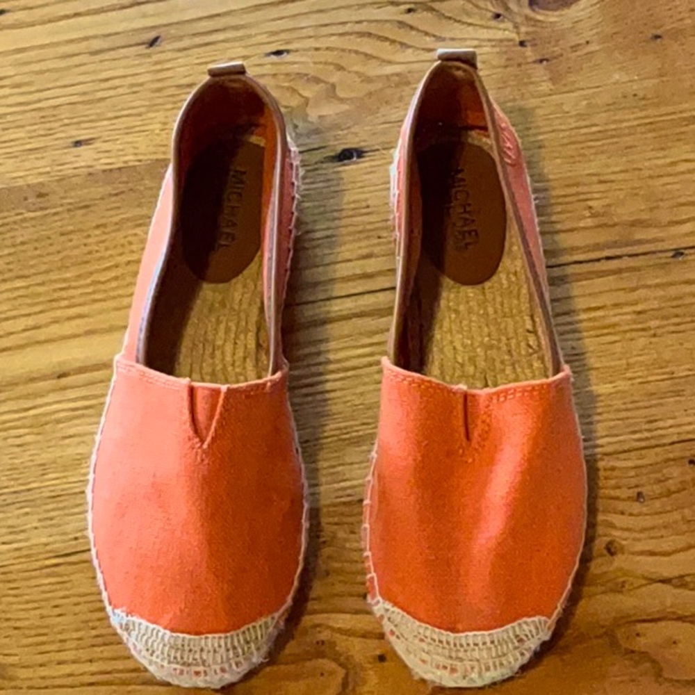 Michael Kors casual shoes. Tangerine in color. Slightly worn. Made of canvas.